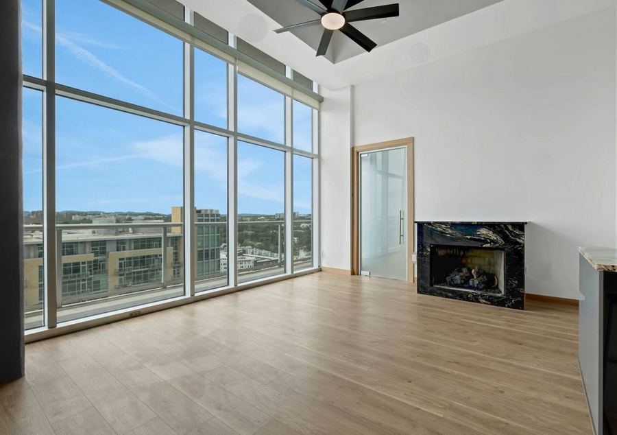 Living room with a west-facing wall of glass, Residence 2210, Nashville